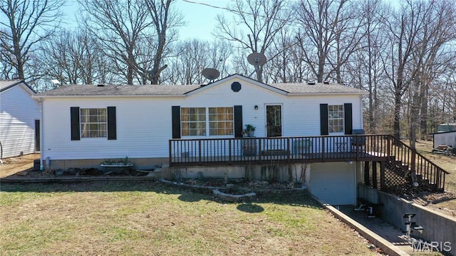 405 County Road 5015, Salem, MO 65560 - view of front of house featuring driveway, a deck, a front yard, an attached garage, and stairway
