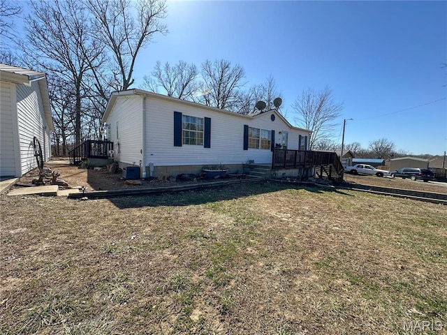 405 County Road 5015, Salem, MO 65560 - manufactured / mobile home featuring a front lawn and central AC unit