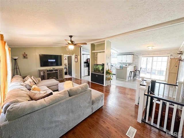 405 County Road 5015, Salem, MO 65560 - living area with a textured ceiling, wood finished floors, and a ceiling fan