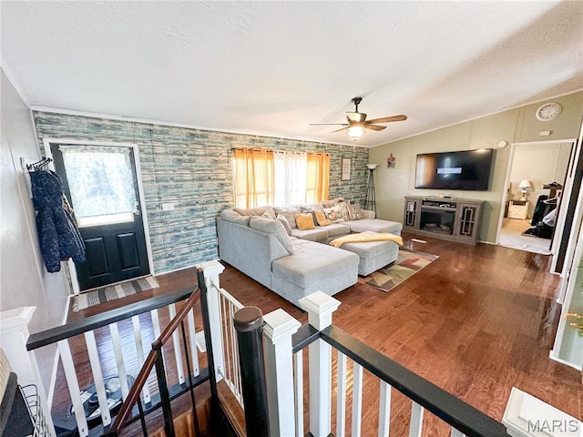 405 County Road 5015, Salem, MO 65560 - living room with lofted ceiling, wood finished floors, ceiling fan, an accent wall, and baseboards