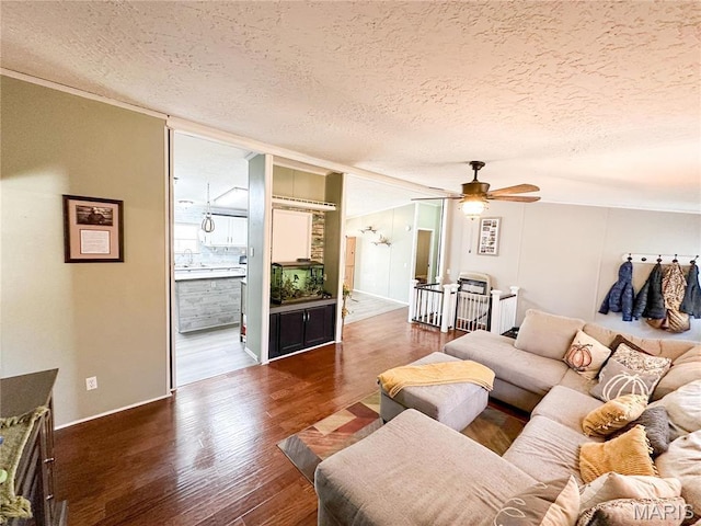 405 County Road 5015, Salem, MO 65560 - living room with a textured ceiling, wood finished floors, ceiling fan, and ornamental molding