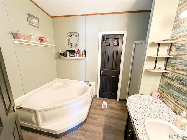 405 County Road 5015, Salem, MO 65560 - bathroom with crown molding, wood finished floors, a garden tub, and vanity