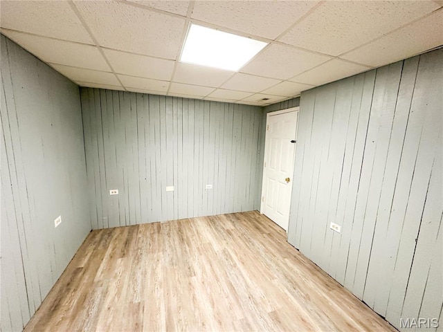 405 County Road 5015, Salem, MO 65560 - unfurnished room with light wood finished floors, a paneled ceiling, and wood walls