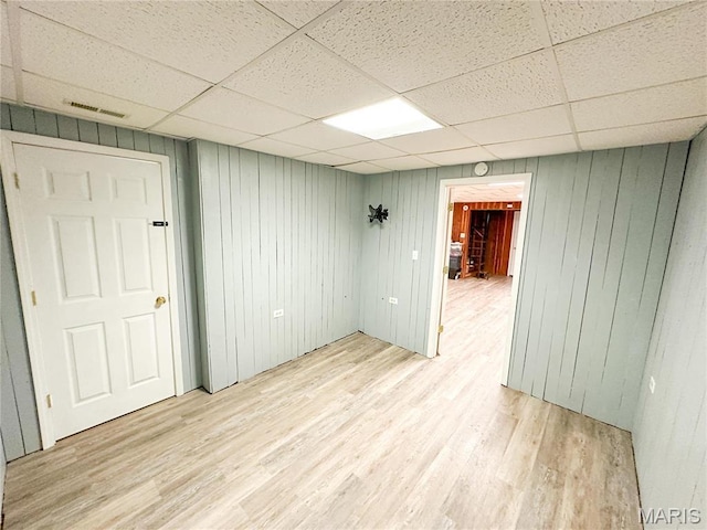 405 County Road 5015, Salem, MO 65560 - spare room featuring a paneled ceiling, wood finished floors, and wooden walls