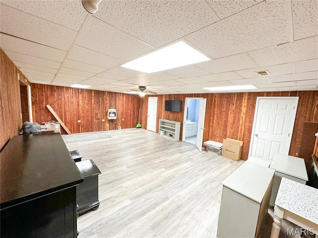 405 County Road 5015, Salem, MO 65560 - finished below grade area with wood walls, a paneled ceiling, wood finished floors, and a ceiling fan