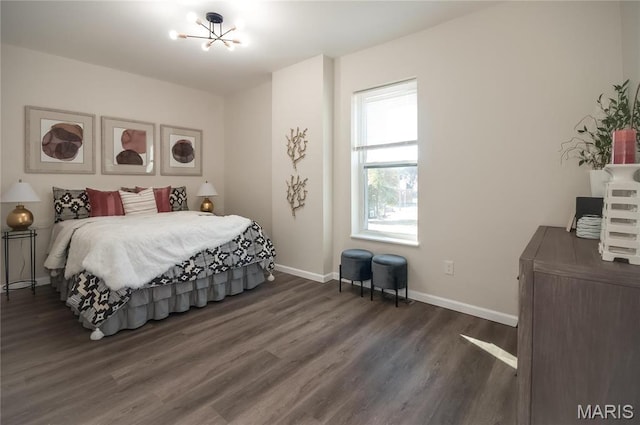 6106 Wilson Ave, Saint Louis, MO 63139 - bedroom with wood finished floors, a chandelier, and baseboards