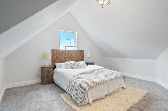 1048 Martha Ln, Saint Louis, MO 63119 - carpeted bedroom with lofted ceiling and baseboards