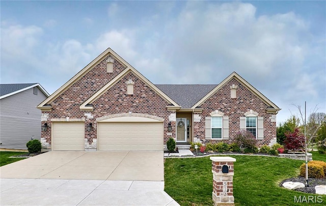 513 Upper Ridgepointe Ct, Lake St Louis, MO 63367 - view of front of property with brick siding, a front lawn, driveway, and a garage