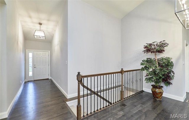 513 Upper Ridgepointe Ct, Lake St Louis, MO 63367 - foyer entrance featuring wood finished floors, baseboards, and lofted ceiling