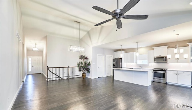 513 Upper Ridgepointe Ct, Lake St Louis, MO 63367 - kitchen featuring appliances with stainless steel finishes, high vaulted ceiling, a center island, plenty of natural light, and light countertops