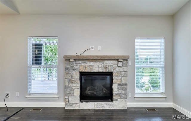 513 Upper Ridgepointe Ct, Lake St Louis, MO 63367 - unfurnished living room with baseboards, a stone fireplace, wood finished floors, and healthy amount of natural light