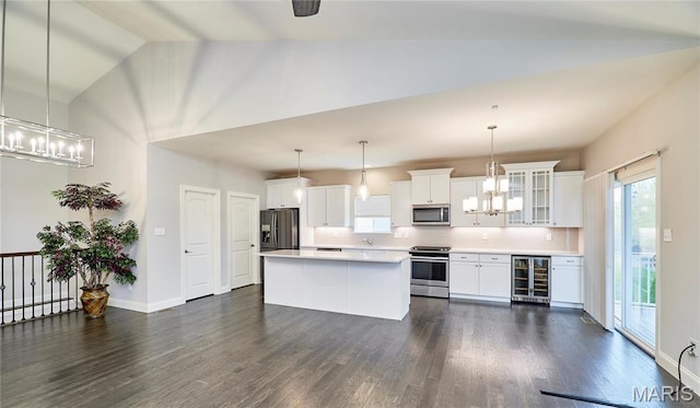 513 Upper Ridgepointe Ct, Lake St Louis, MO 63367 - kitchen with stainless steel appliances, wine cooler, a chandelier, dark wood-style floors, and vaulted ceiling