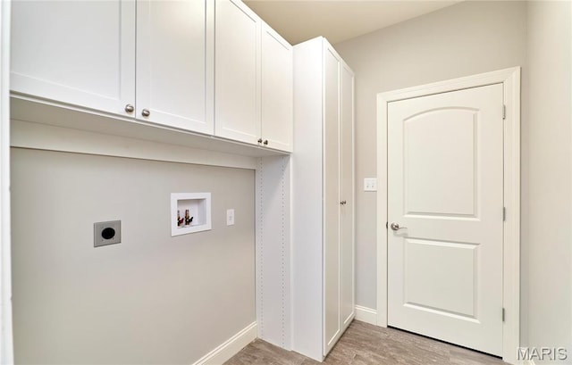 513 Upper Ridgepointe Ct, Lake St Louis, MO 63367 - clothes washing area featuring hookup for an electric dryer, hookup for a washing machine, cabinet space, baseboards, and light wood-style flooring