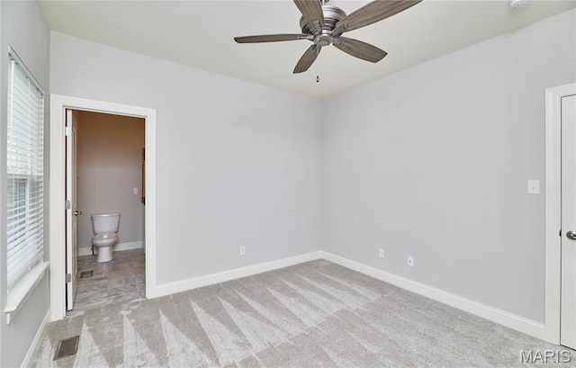 513 Upper Ridgepointe Ct, Lake St Louis, MO 63367 - unfurnished bedroom with carpet floors, connected bathroom, baseboards, and a ceiling fan