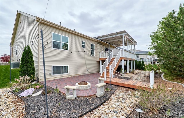 513 Upper Ridgepointe Ct, Lake St Louis, MO 63367 - back of house with a fire pit, a patio, a wooden deck, and stairway