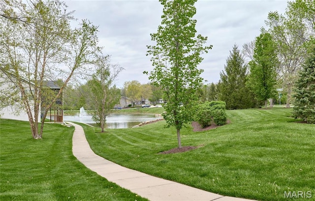 513 Upper Ridgepointe Ct, Lake St Louis, MO 63367 - view of home's community with a water view and a lawn