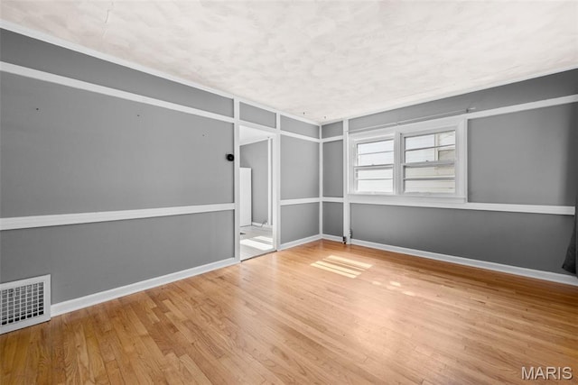 6541 SW Ave, Saint Louis, MO 63139 - unfurnished room with wood finished floors and a textured ceiling