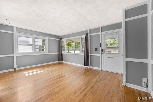 6541 SW Ave, Saint Louis, MO 63139 - spare room with wood finished floors and baseboards