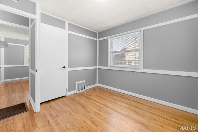 6541 SW Ave, Saint Louis, MO 63139 - unfurnished room with wood finished floors and crown molding