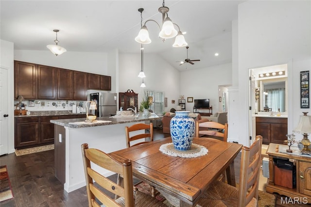 5374 Trailhead Ct, Eureka, MO 63025 - dining room with high vaulted ceiling, dark wood-style flooring, and ceiling fan