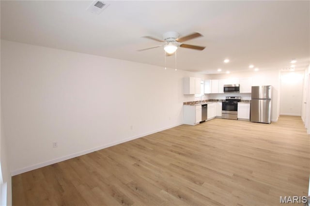 0 Modern St, Sullivan, MO 63080 - unfurnished living room with ceiling fan, light wood-type flooring, recessed lighting, baseboards, and a sink