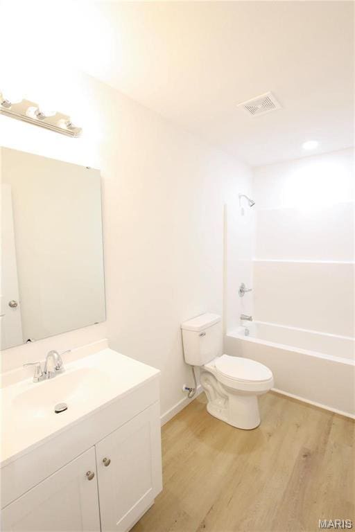 0 Modern St, Sullivan, MO 63080 - full bath with toilet, wood finished floors, vanity, and bathtub / shower combination