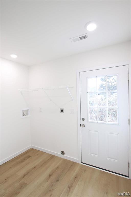 0 Modern St, Sullivan, MO 63080 - laundry room featuring light wood finished floors, hookup for a washing machine, hookup for an electric dryer, baseboards, and recessed lighting