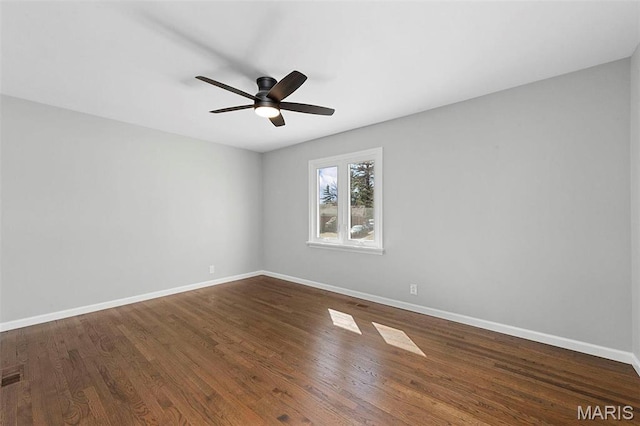 86 Heather View Dr, Chesterfield, MO 63017 - unfurnished room featuring baseboards, ceiling fan, and dark wood-style flooring