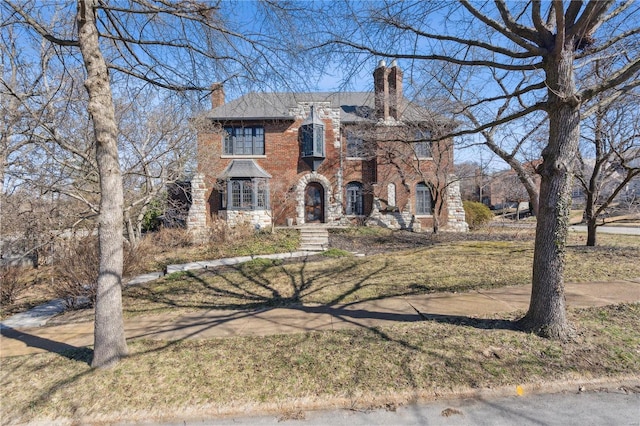 364 Mission Ct, Saint Louis, MO 63130 - view of front facade featuring a chimney and brick siding