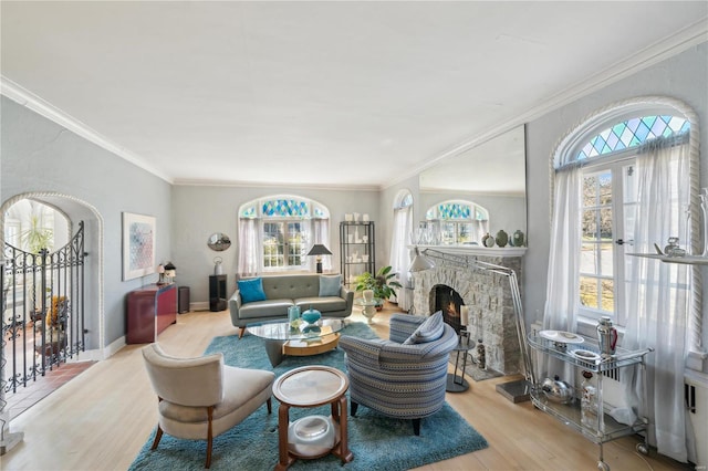 364 Mission Ct, Saint Louis, MO 63130 - living area with wood finished floors, crown molding, and a fireplace
