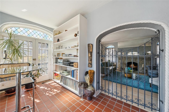 364 Mission Ct, Saint Louis, MO 63130 - misc room featuring french doors, tile patterned flooring, vaulted ceiling, arched walkways, and built in features