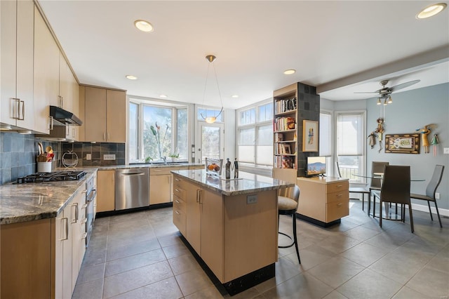 364 Mission Ct, Saint Louis, MO 63130 - kitchen featuring dishwasher, under cabinet range hood, backsplash, a center island, and recessed lighting