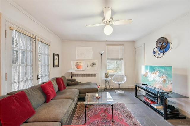 364 Mission Ct, Saint Louis, MO 63130 - living room with crown molding, ceiling fan, radiator heating unit, tile patterned floors, and baseboards