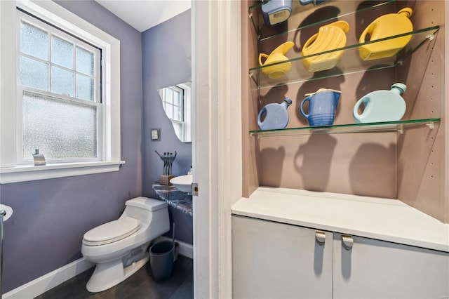 364 Mission Ct, Saint Louis, MO 63130 - half bathroom featuring baseboards, toilet, and vanity