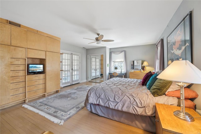 364 Mission Ct, Saint Louis, MO 63130 - bedroom with light wood-style floors and ceiling fan