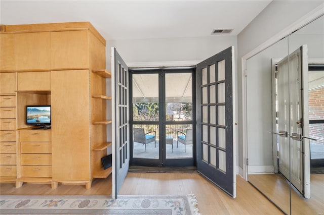 364 Mission Ct, Saint Louis, MO 63130 - doorway featuring french doors, light wood finished floors, and plenty of natural light