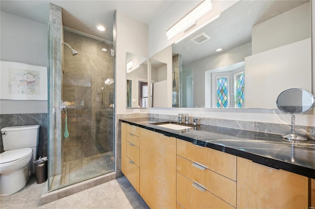 364 Mission Ct, Saint Louis, MO 63130 - bathroom featuring a shower stall, toilet, vanity, recessed lighting, and tile walls