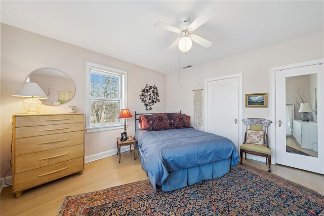 364 Mission Ct, Saint Louis, MO 63130 - bedroom with light wood-type flooring, baseboards, and a ceiling fan