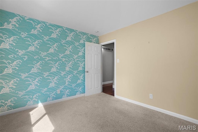 438 Rockview Dr, Saint Louis, MO 63129 - bedroom featuring wallpapered walls, carpet, and an accent wall