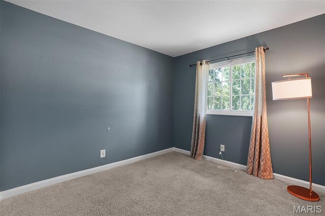 438 Rockview Dr, Saint Louis, MO 63129 - carpeted empty room featuring baseboards