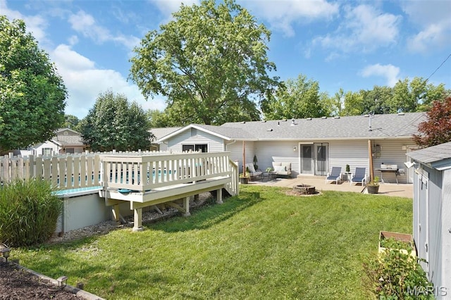 438 Rockview Dr, Saint Louis, MO 63129 - back of property with a patio area, a wooden deck, and a fire pit