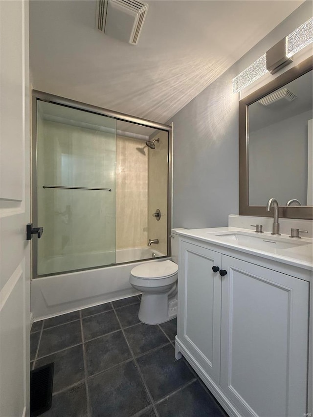 6043 Parkedge Dr, House Springs, MO 63051 - full bath featuring toilet, tile patterned floors, vanity, and combined bath / shower with glass door