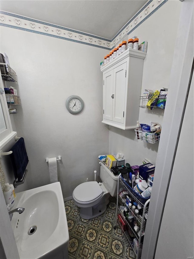 bathroom with a sink and toilet