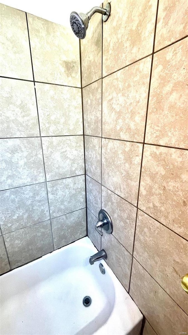 bathroom featuring shower / washtub combination
