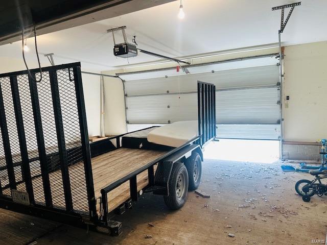 247 Harrison Ln, Poplar Bluff, MO 63901 - garage featuring a garage door opener