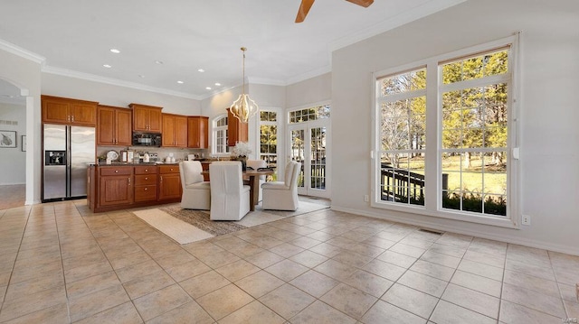 kitchen with stainless steel fridge, black microwave, light tile patterned flooring, a ceiling fan, and recessed lighting