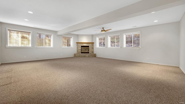 unfurnished living room with carpet, baseboards, and recessed lighting
