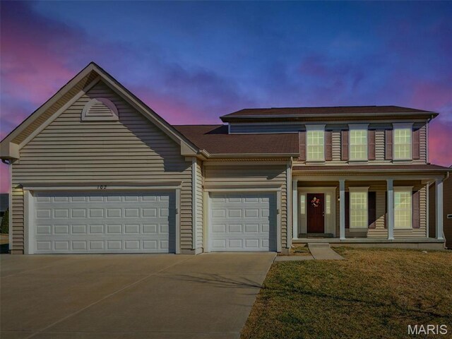 102 Carlton Point Dr, Wentzville, MO 63385 - view of front of property featuring concrete driveway, a porch, and an attached garage