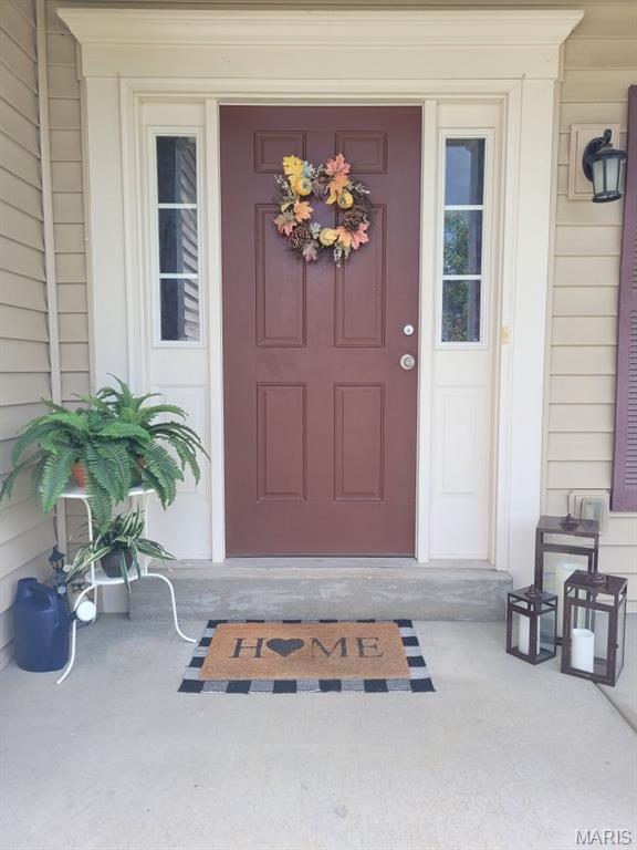 102 Carlton Point Dr, Wentzville, MO 63385 - doorway to property featuring a porch