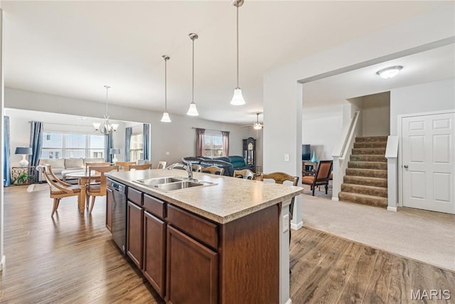102 Carlton Point Dr, Wentzville, MO 63385 - kitchen with open floor plan, stainless steel dishwasher, light wood-style floors, and light countertops